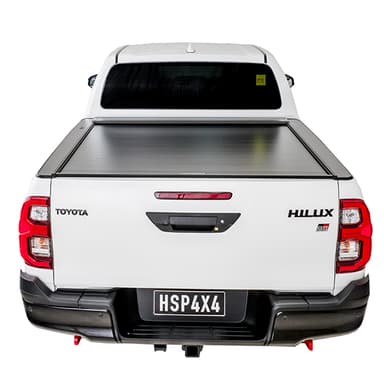 White Toyota Hilux SR5 with roller cover closed rear view alternate