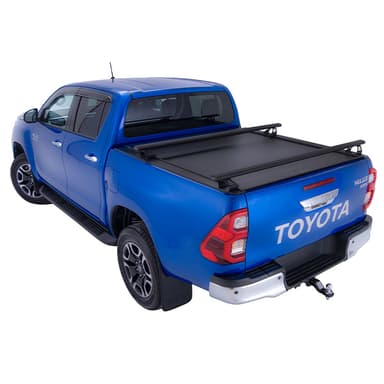 Blue Toyota Hilux SR5 with HSP roller cover closed and load bars fitted rear three-quarter studio image