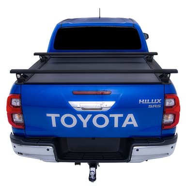 Blue Toyota Hilux SR5 with HSP roller cover closed and load bars fitted straight rear view