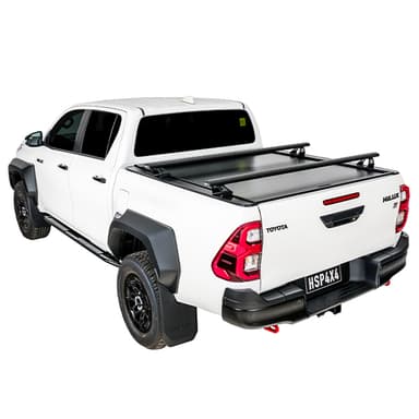 White Toyota Hilux SR5 with HSP roller cover closed and load bars fitted rear three-quarter view