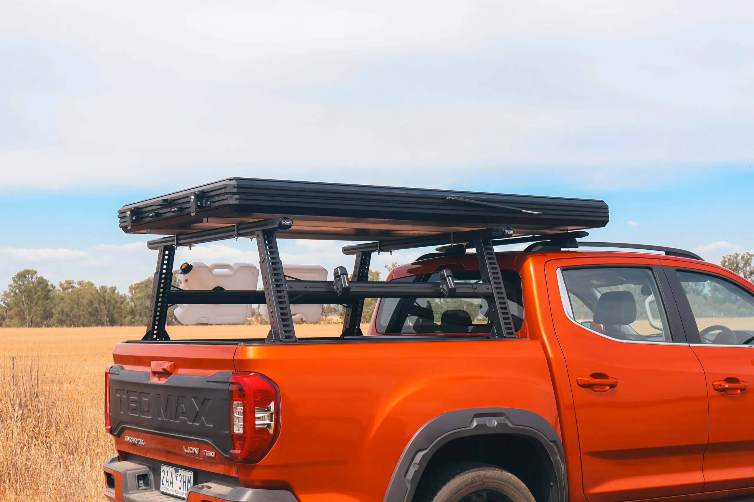 Ford Ranger Ladder Rack: HSP Load Rack Pro mounted above the tub and carrying ladders