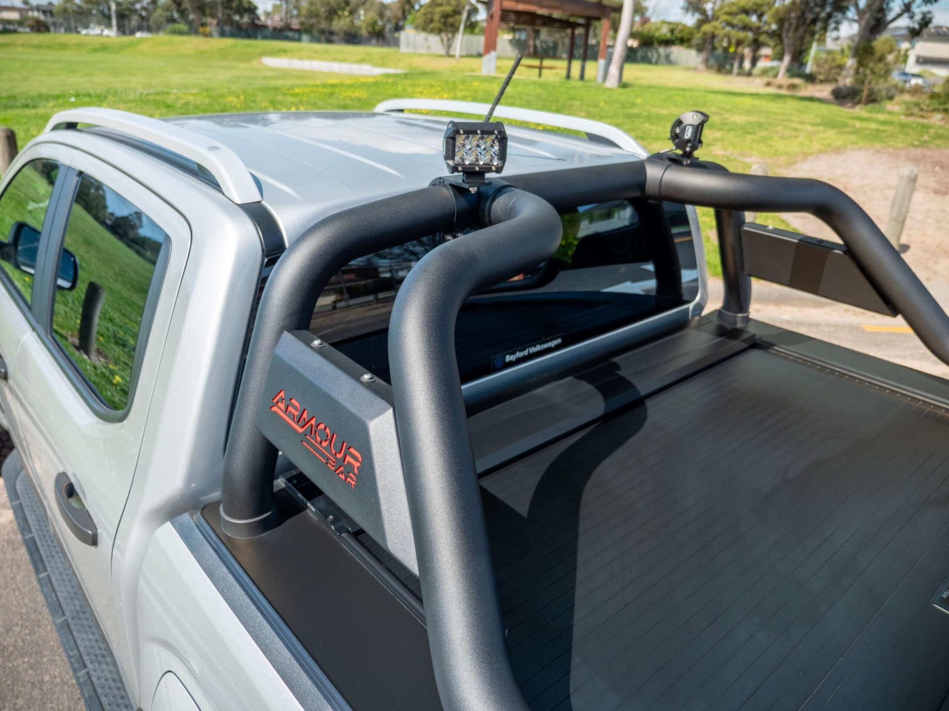Image showing ute sports bar equipped with mounted light bar and spotlights, highlighting accessory compatibility for enhanced visibility and off-road use.
