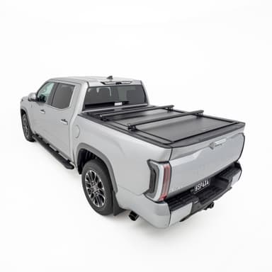 HSP Load Bars installed over closed HSP Roller Cover on grey Toyota Tundra, rear three quarter view showing dual bar setup