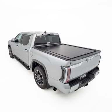 Rear three quarter view of silver Toyota Tundra showing closed HSP Roller Cover
