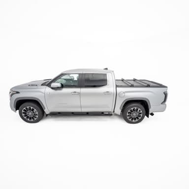 Grey Toyota Tundra side profile with closed HSP Roller Cover and low profile HSP Load Bars fitted for roof carrying capability