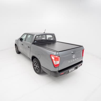 Ssangyong Musso equipped with roller shutter, providing secure tub coverage, weatherproof protection, and accessory compatibility for work and adventure.