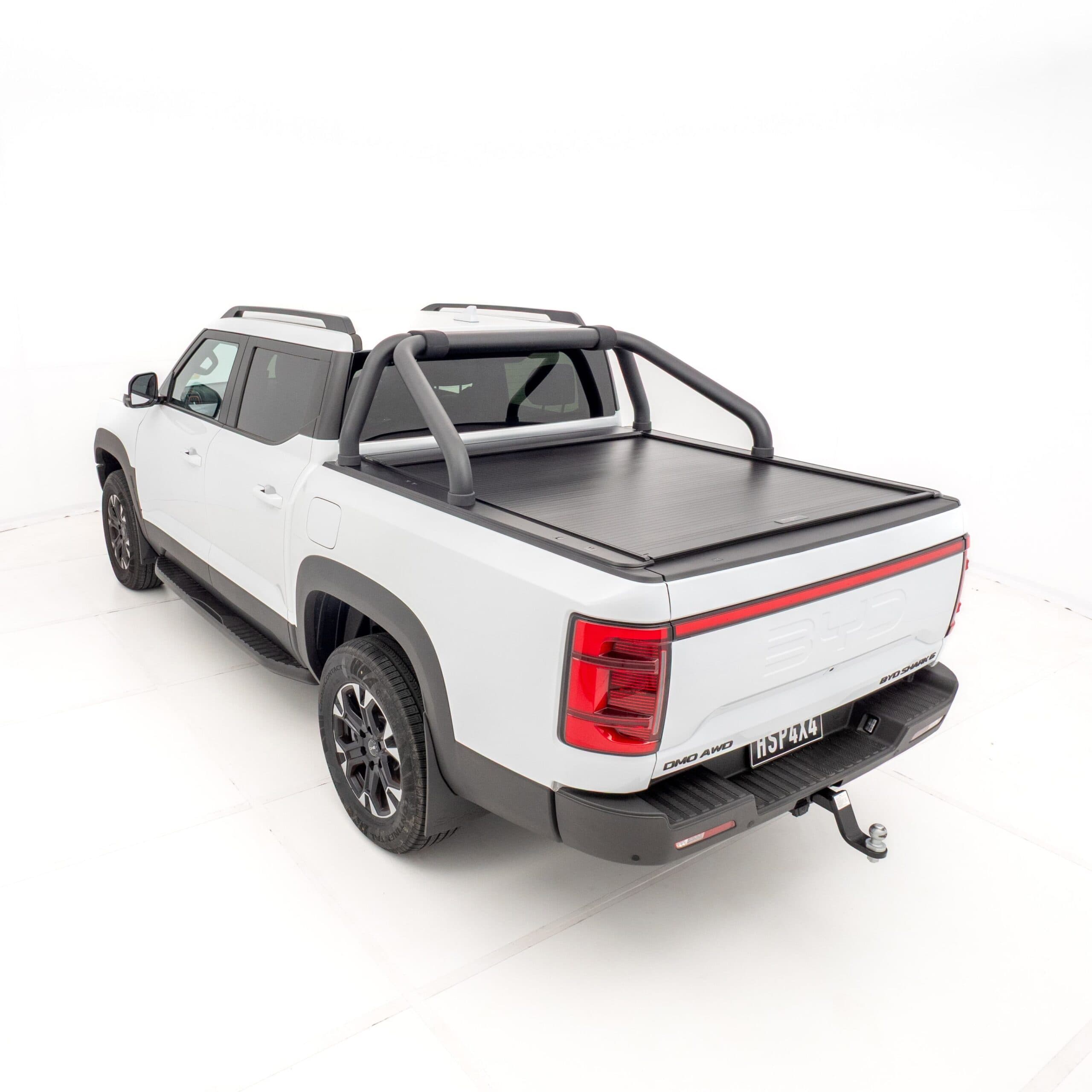 Heavy-duty roller shutter cover installed on BYD Shark Sports Bar, designed for secure and weather-resistant ute storage; ideal for off-road and utility vehicles seeking enhanced functionality and style.