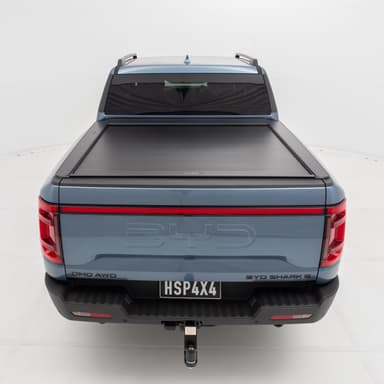 HSP Roll R electric roller cover installed on BYD Shark 6 with over‑the‑air Wi‑Fi updates activated in app.