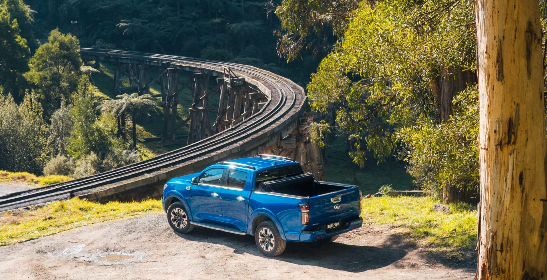 HSP Roll Mate tonneau cover fitted to GWM Haval Cannon Ute parked at a campsite