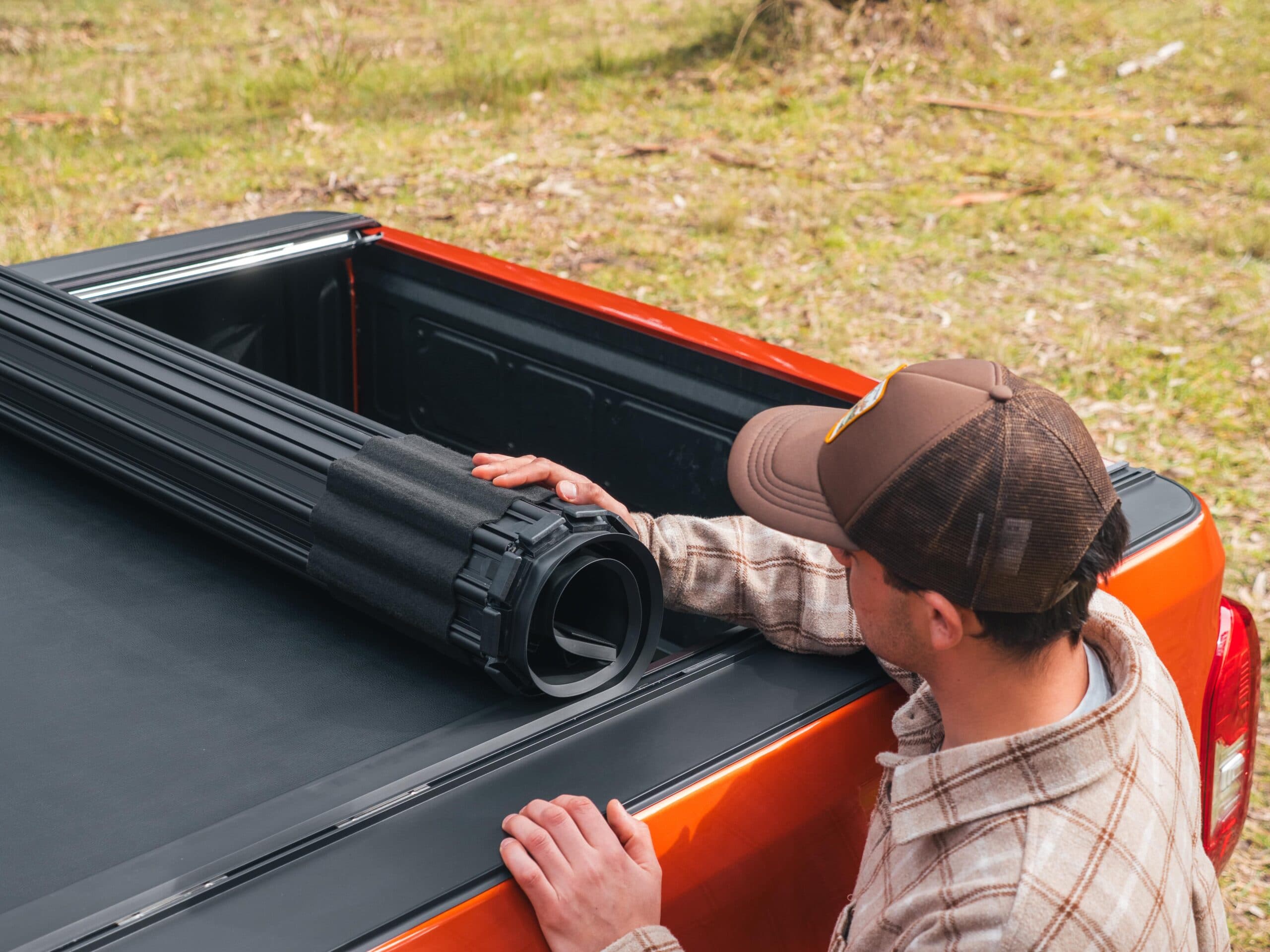 Showing the roll-up function on the Roll Mate Tonneau Cover for dual cab utes.
